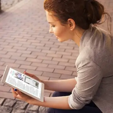 Woman Reading a Digital Magazine